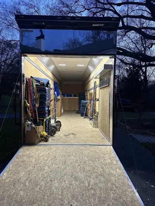 Trailer ramp extending into a covered loading area